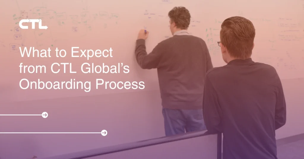 CTL team at a whiteboard working on a Client on-boarding project.