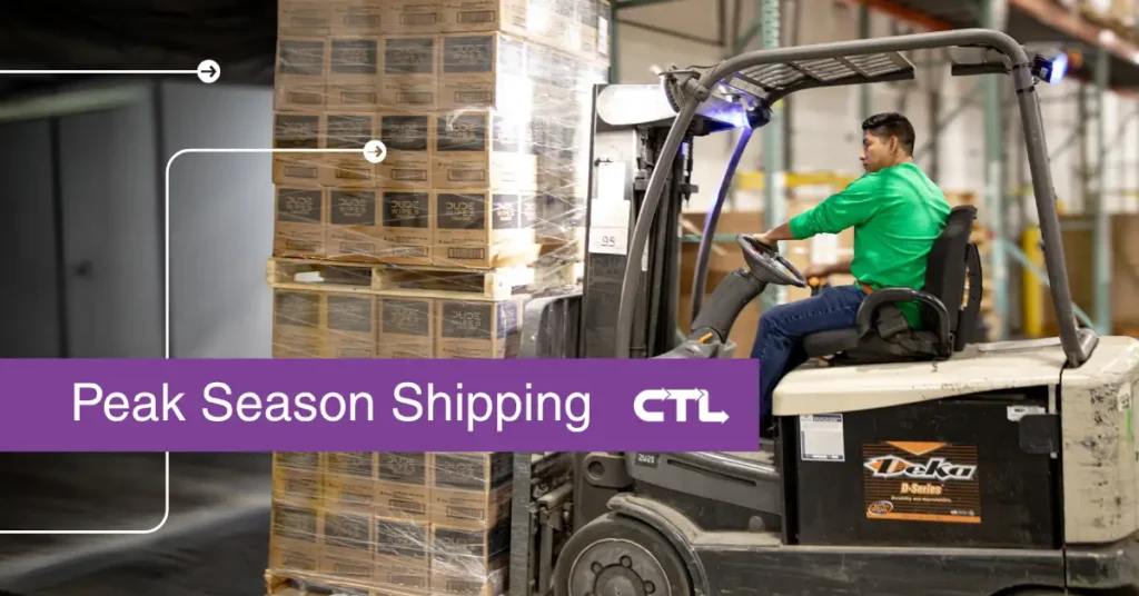 Loading a truck with pallets during a peak season shipping rush.